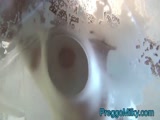 Squirting pregnant breast milk on the glass table